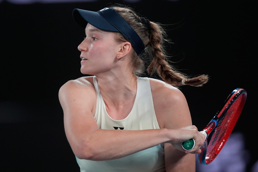 Elena Rybakina of Kazakhstan plays a forehand return to Jessica Pegula of the U.S. during their semifinal match at the Australian Open tennis championship in Melbourne, Australia, Thursday, Jan. 29, 2026. (AP Photo/Asanka Brendon Ratnayake)