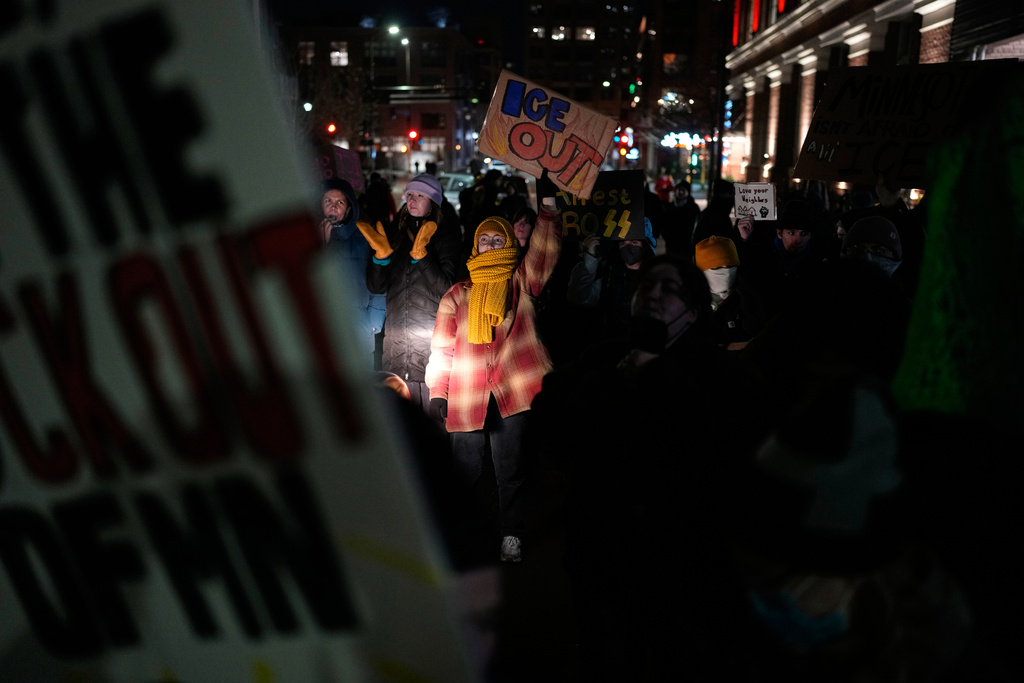 People participate in a protest and noise demonstration calling for an end to federal immigration enforcement operations in the city, Friday, Jan. 9, 2026, in Minneapolis. (AP Photo/John Locher)