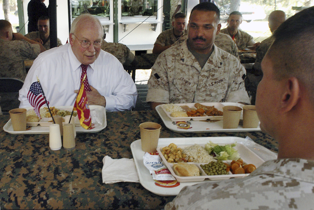FILE- Vice President Dick Cheney talks with a Marine and Cpl. Todd J. Corbin, right, of Sandusky Ohio, during a luncheon with marines from the 3rd Battalion, 25th Marine Regiment in an outdoor field house on Monday, Oct. 3, 2005 at Camp Lejeune, NC. (AP Photo/Sara D. Davis, file)