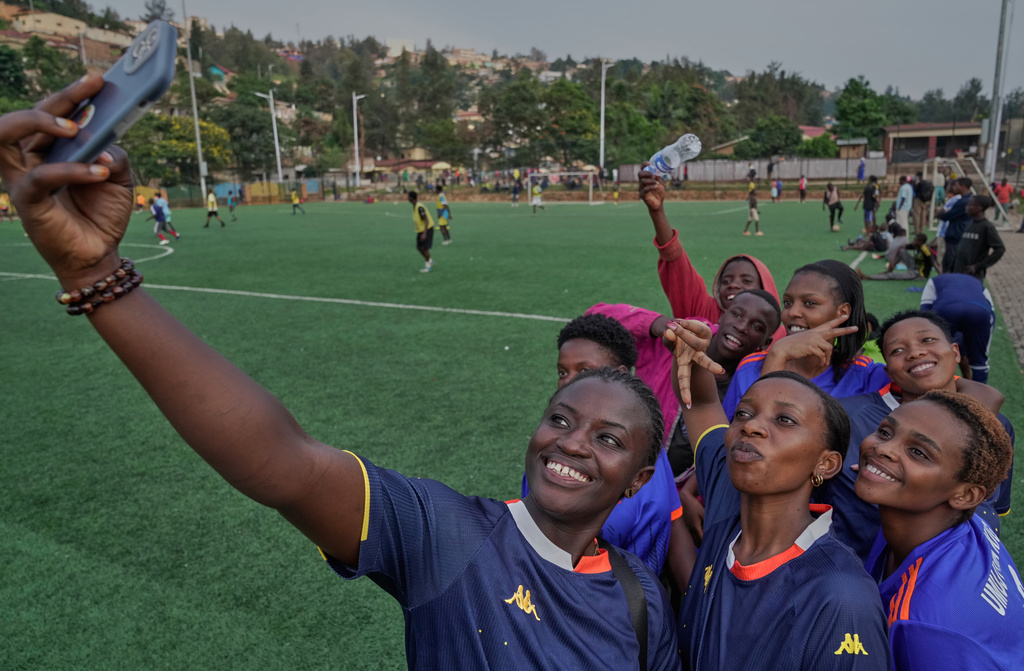 Soccer players on the Rwanda Amputee team pose for a selfie after a training session in Kigali, Rwanda, on Friday, March 20, 2026. (AP Photo/Brian Inganga)