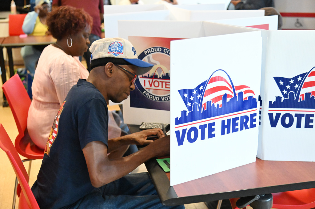 Voters cast their ballots on primary election day Tuesday, Aug. 4, 2026, in St. Louis. (AP Photo/Michael Thomas)
