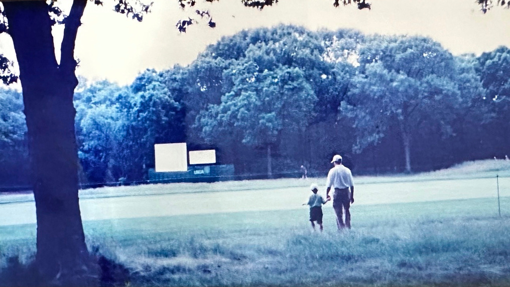 In this image provided by Barbara Young, Cameron Young, 5, holds his father's hand at Bethpage Black during the final round of the U.S. Open golf tournament, June 16, 2002, in Farmingdale, NY. (AP Photo/Barbara Young)