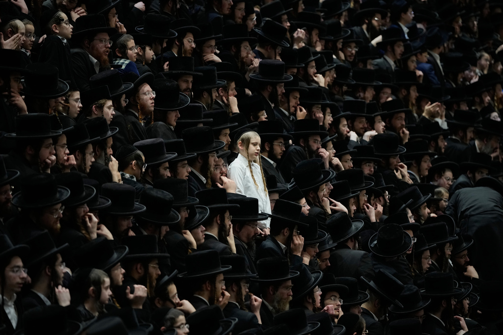 Ultra-Orthodox Jews from the Belz Hasidic dynasty celebrate the Jewish holiday of Tu Bishvat, the "New Year of the Trees," in Jerusalem, Monday, Feb. 2, 2026. (AP Photo/Ohad Zwigenberg)