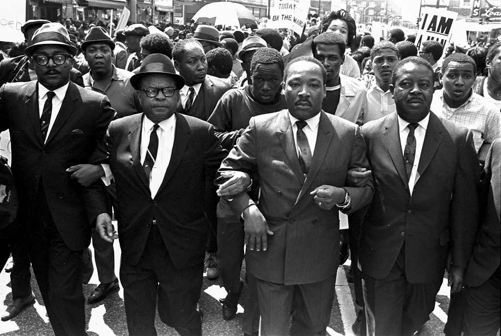 FILE - The Rev. Ralph Abernathy, right, and Bishop Julian Smith, left, flank Dr. Martin Luther King, Jr., during a civil rights march in Memphis, Tenn., March 28, 1968. (AP Photo/Jack Thornell, File)