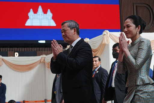 Cambodian Prime Minister Hun Manet, left, greets his officers together with his wife Pich Chanmony as they inaugurate Techo International Airport in Kandal province, Cambodia, Monday, Oct. 20, 2025. (AP Photo/Heng Sinith) Cambodian Prime Minister Hun Manet, left, greets his officers together with his wife Pich Chanmony as they inaugurate Techo International Airport in Kandal province, Cambodia, Monday, Oct. 20, 2025. (AP Photo/Heng Sinith)