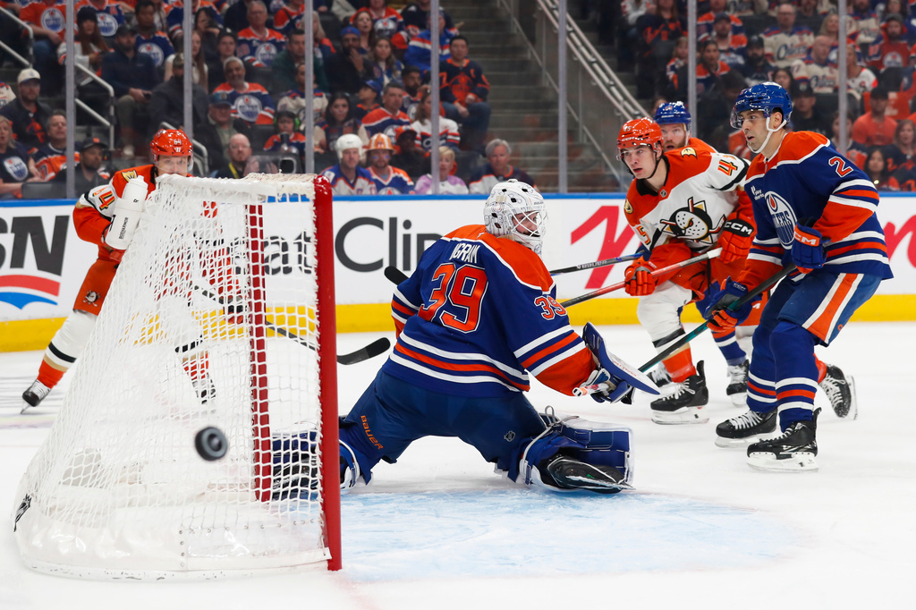 Anaheim Ducks' Beckett Sennecke (45) shoots against Edmonton Oilers' goaltender Connor Ingram (39) during the first period of Game 1 in a first-round NHL hockey Stanley Cup playoff series in Edmonton, Alberta, Monday, April 20, 2026. (Codie McLachlan/The Canadian Press via AP)