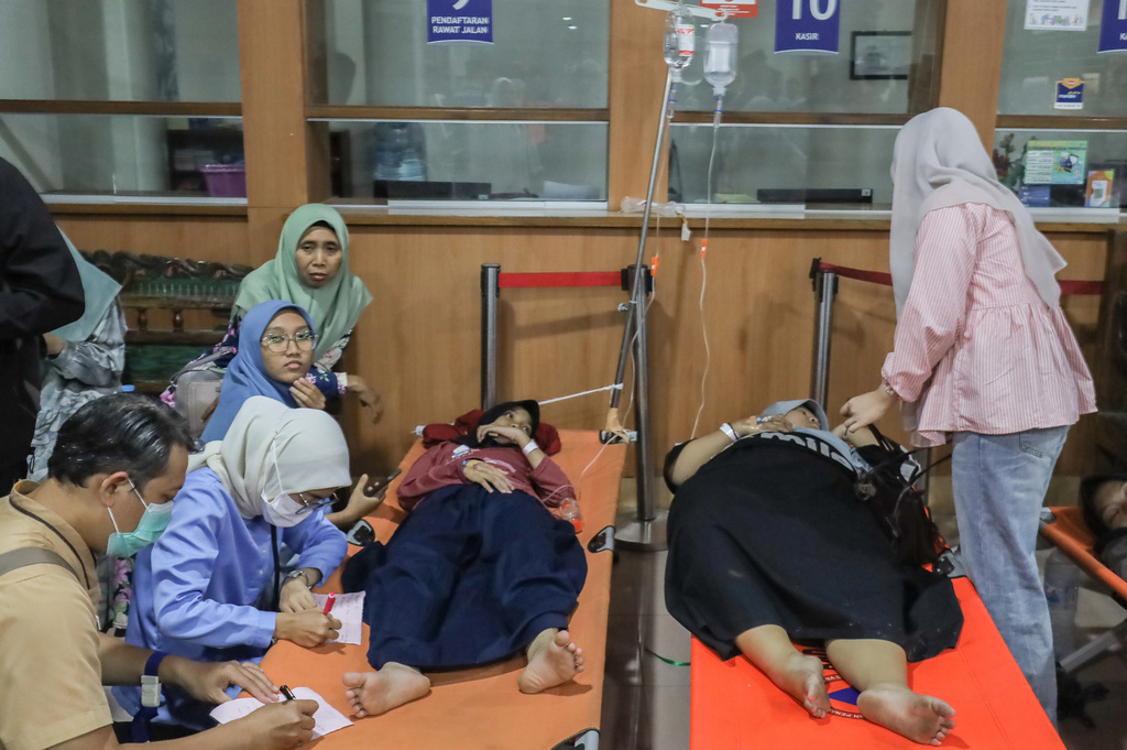 Students who fell ill allegedly due to food poisoning after consuming free meals at their school receive medical treatment at a hospital in Sidoarjo, East Java, Indonesia, Wednesday, Sept. 2, 2026. (AP Photo/Jusuf Aydin)