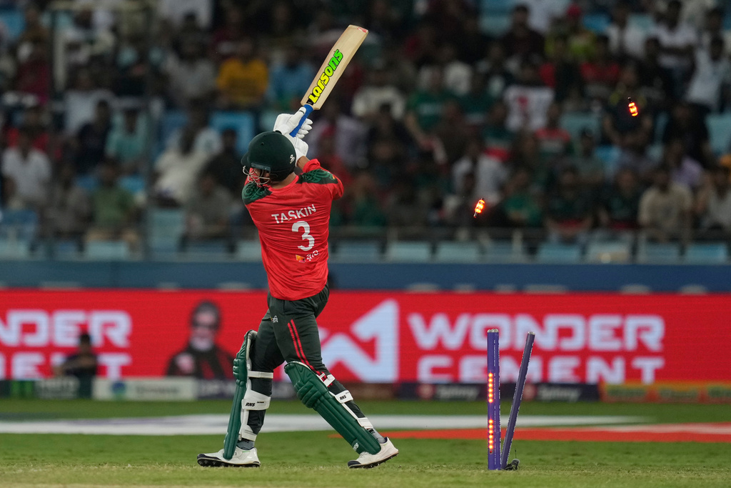Bangladesh's Taskin Ahmed bowled out by Pakistan's Haris Rauf during the Asia Cup cricket match between Bangladesh and Pakistan at Dubai International Cricket stadium in Dubai, United Arab Emirates, Thursday, Sept. 25, 2025. (AP Photo/Altaf Qadri)