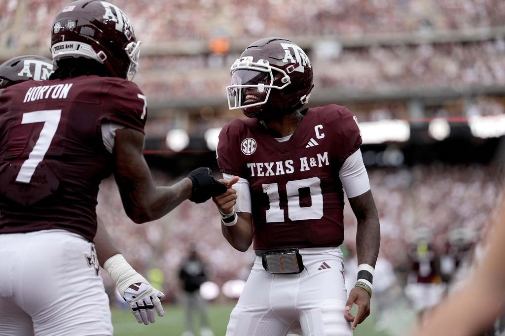 Texas A&M quarterback Marcel Reed (10) reacts with teammate Isaiah Horton (7) after a touchdown against Missouri State during the first quarter of an NCAA college football game Saturday, Sept. 5, 2026, in College Station, Texas. (AP Photo/Sam Craft)
