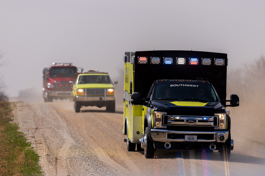Malcolm and Lincoln firefighters respond to a wildfire in Denton, Neb., on Thursday, March 12, 2026. (Kenneth Ferriera/Omaha World-Herald via AP)