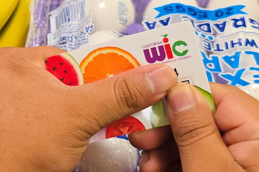 A shopper shows their WIC card on Monday, Oct. 27, 2025, in Los Angeles. (AP Photo/Damian Dovarganes) A shopper shows their WIC card on Monday, Oct. 27, 2025, in Los Angeles. (AP Photo/Damian Dovarganes)