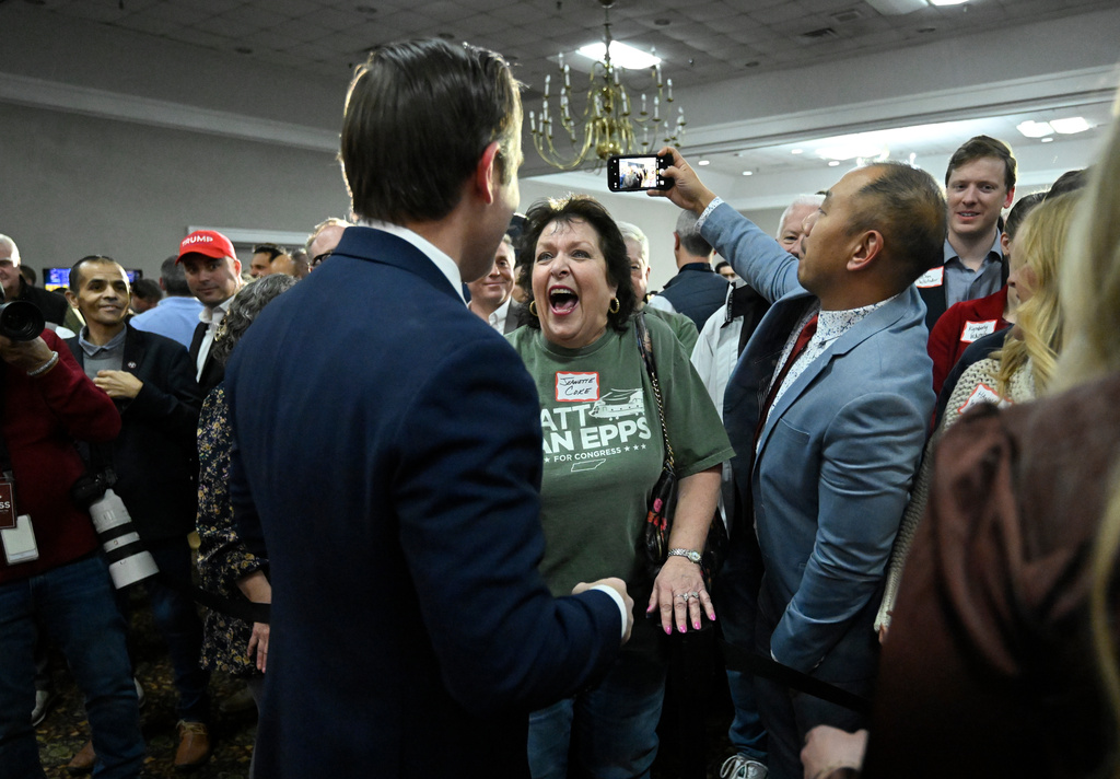 Republican candidate Matt Van Epps interacts with supporters at a watch party after announcing victory in a special election for the U.S. seventh congressional district, Tuesday, Dec. 2, 2025, in Nashville, Tenn. (AP Photo/John Amis)