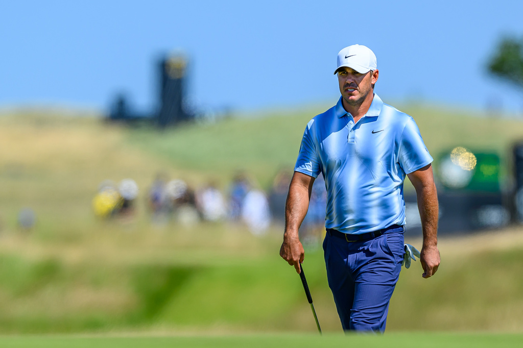 Brooks Koepka, of the United States, walks to the ninth green during day one of the Genesis Scottish Open 2026 at The Renaissance Club in North Berwick, Scotland, Thursday, July 9, 2026. (Malcolm Mackenzie/PA via AP)