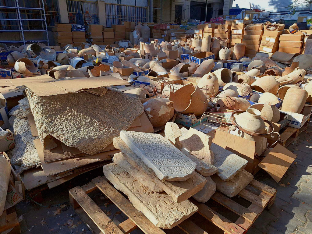 This photo provided by Première Urgence Internationale, the archaeological items after they were moved to an undisclosed safer location where they are stored outside and still in danger of being destroyed by Israeli strikes, in Gaza City, Gaza Strip, on Sept. 11, 2025. (Première Urgence Internationale (PUI) via AP)