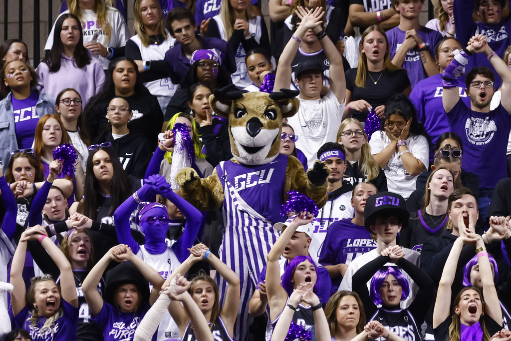 FILE - Grand Canyon mascot Thunder the Antelope, center, stands in the student section during the second half of an NCAA college basketball game between Grand Canyon and Texas-Arlington in the championship of the Western Athletic Conference tournament Saturday, March 15, 2025, in Las Vegas. (AP Photo/Chase Stevens,File)