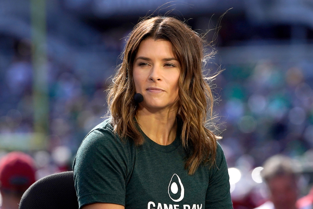 FILE - Danica Patrick sits on the set of ESPN's College Game Day program as a guest picker in Soldier Field before an NCAA college football game between Wisconsin and Notre Dame, Sept. 25, 2021, in Chicago. (AP Photo/Charles Rex Arbogast, File)