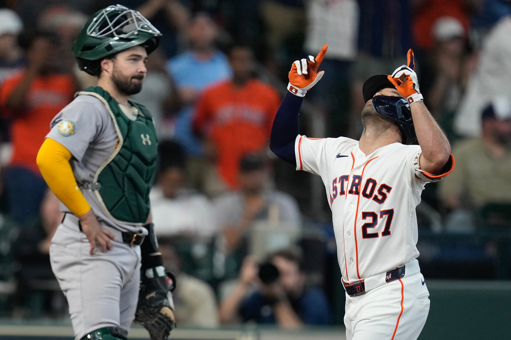 Houston Astros' Jose Altuve (27) celebrates after his solo home run against the Athletics during the third inning of a baseball game, Saturday, June 6, 2026, in Houston. (AP Photo/Eric Christian Smith)
