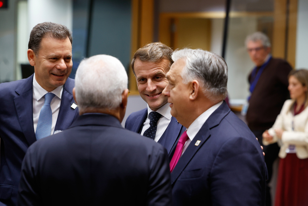 From left, Portugal's Prime Minister Luis Montenegro, European Council President Antonio Costa, French President Emmanuel Macron and Hungary's Prime Minister Viktor Orban during a round table meeting at the EU Summit in Brussels, Thursday, Dec. 18, 2025. (AP Photo/Geert Vanden Wijngaert)