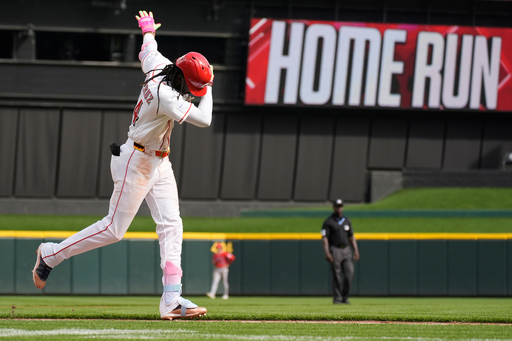 Cincinnati Reds' Elly de la Cruz celebrates as he rounds the bases after hitting a three-run homer during the ninth inning of a baseball game against the Los Angeles Angels in Cincinnati, Sunday, April 12, 2026. (AP Photo/Carolyn Kaster)