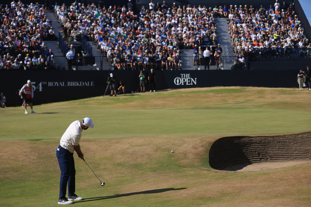 Scottie Scheffler of the United States putts onto the 18th green during the final day of the British Open Golf championships at Royal Birkdale golf club, in Southport, England, Sunday, July 19, 2026. (AP Photo/Peter Morrison)