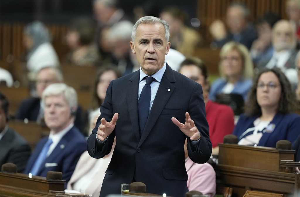 Prime Minister Mark Carney rises during Question Period on Parliament Hill in Ottawa, Canada, Thursday, Oct. 2, 2025. (Adrian Wyld/The Canadian Press via AP)
