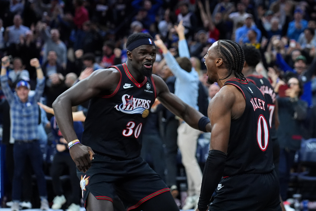 Philadelphia 76ers' Tyrese Maxey, right, and Adem Bona celebrate after the 76ers won an NBA basketball game against the Golden State Warriors Thursday, Dec. 4, 2025, in Philadelphia. (AP Photo/Matt Slocum)