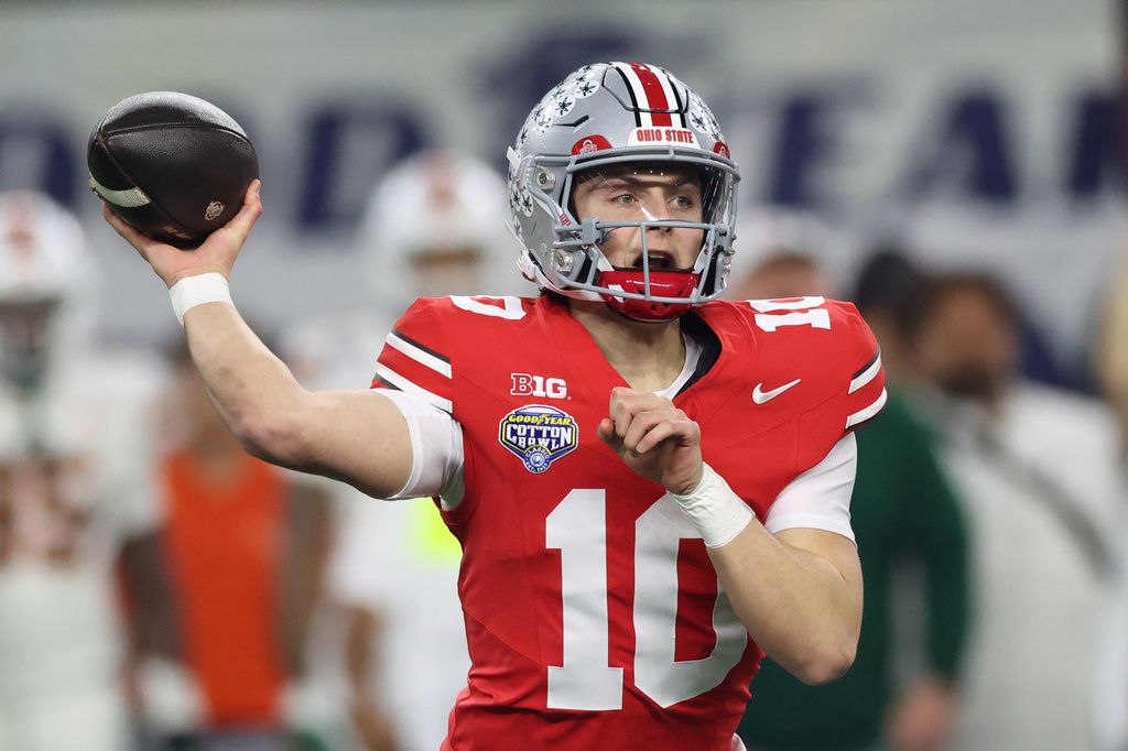 FILE - Ohio State quarterback throws a pass against Miami during the first half of the Cotton Bowl College Football Playoff quarterfinal game Dec. 31, 2025, in Arlington, Texas. (AP Photo/Gareth Patterson, File)