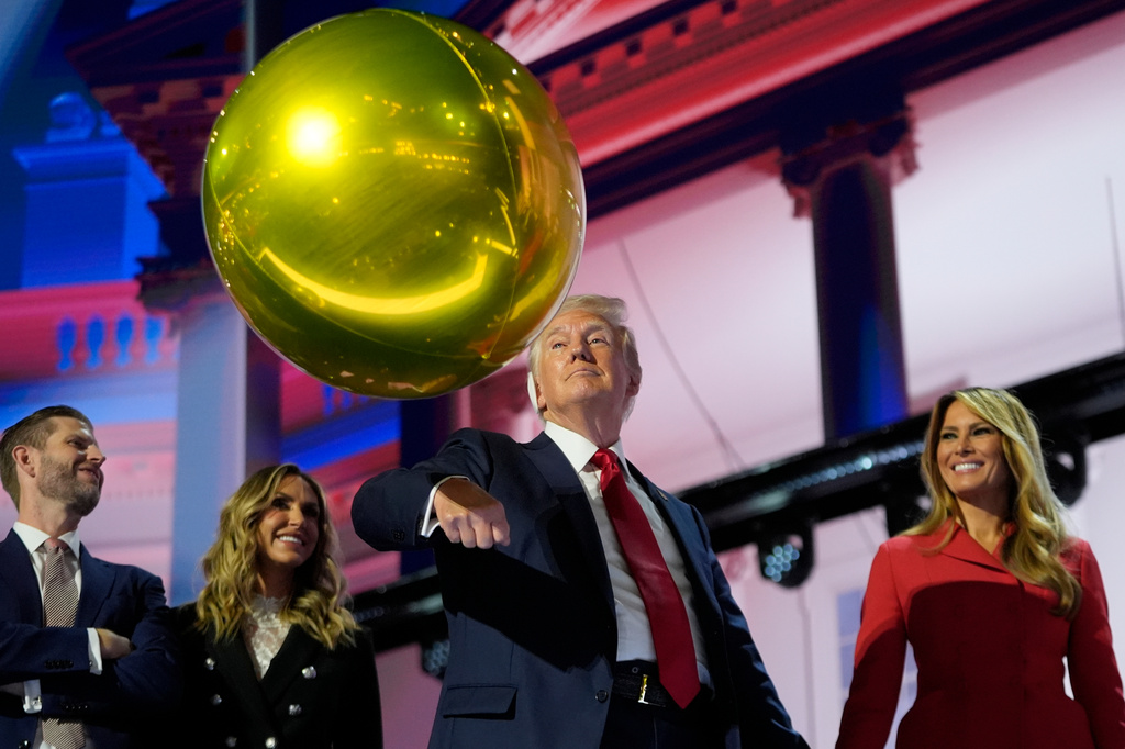 FILE - Republican presidential candidate former President Donald Trump hits a balloon during the final day of the Republican National Convention, July 18, 2024, in Milwaukee. (AP Photo/Paul Sancya, File)
