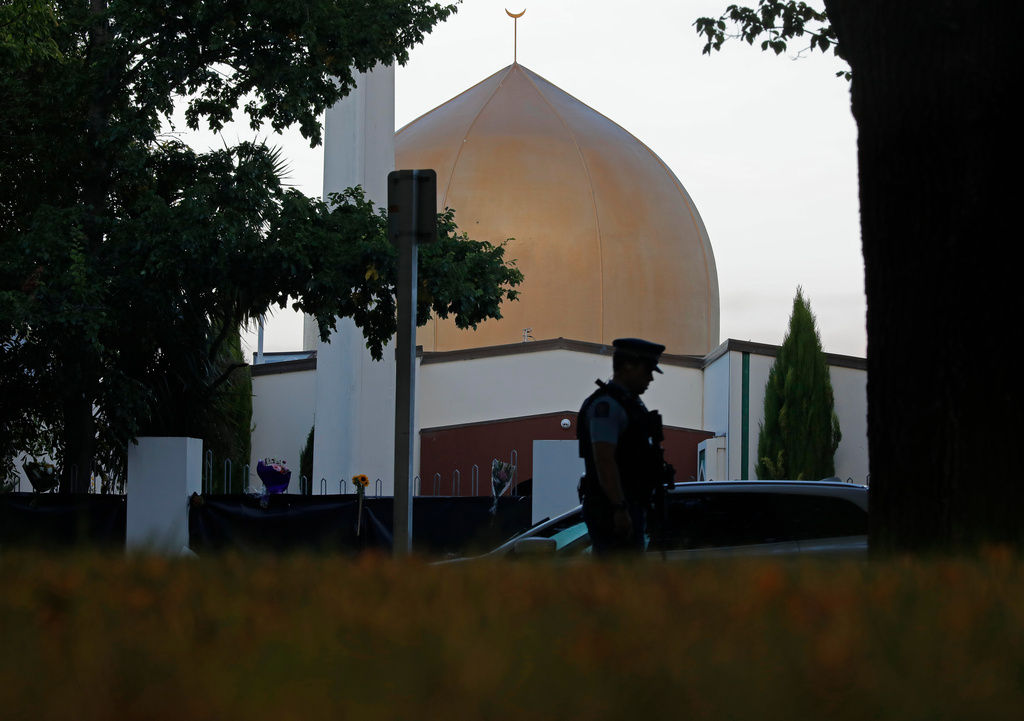 FILE - A police officer stands guard in front of the Al Noor mosque, in Christchurch, New Zealand, March 17, 2019. (AP Photo/Vincent Yu, File)