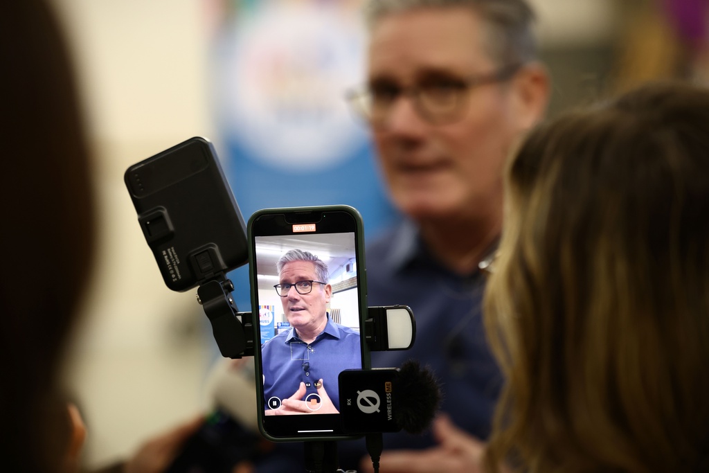 Britain's Prime Minister Keir Starmer speaks to members of the media during a visit to a "family hub" at St. Mary's Church Hall in Goldington, Bedfordshire, north of London, Thursday, Jan. 8, 2026. (Henry Nicholls/Pool Photo via AP)