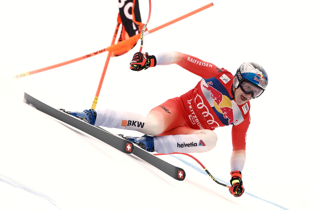 Switzerland's Marco Odermatt speeds down the course during a men's alpine ski World Cup downhill, in Kitzbuehel, Austria, Saturday, Jan. 24, 2026. (AP Photo/Gabriele Facciotti)