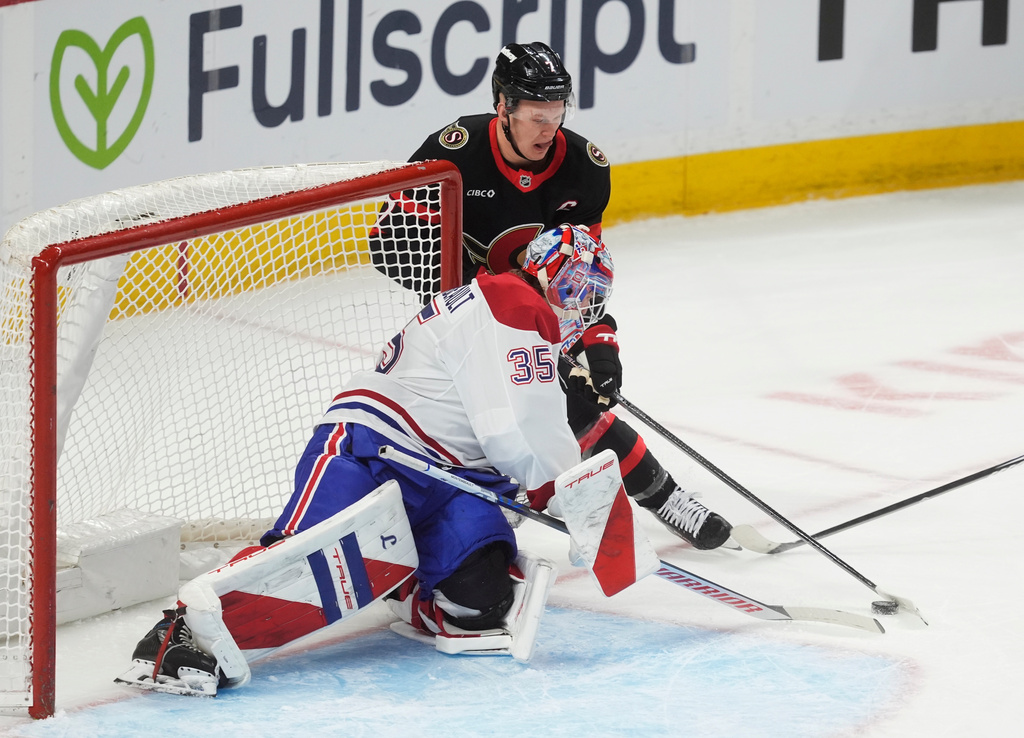 Ottawa Senators left wing Brady Tkachuk (7) is stopped by Montreal Canadiens goaltender Samuel Montembeault (35) during first-period NHL hockey game action in Ottawa, Ontario, Saturday, Jan. 17, 2026. (Adrian Wyld/The Canadian Press via AP)