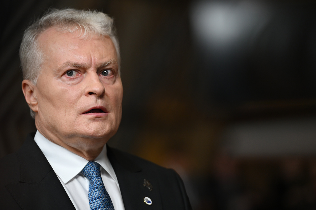 Lithuania's President Gitanas Nauseda speaks with the media as he arrives for an EU Summit at the European Council building in Brussels, Thursday, Oct. 23, 2025. (AP Photo/Harry Nakos)