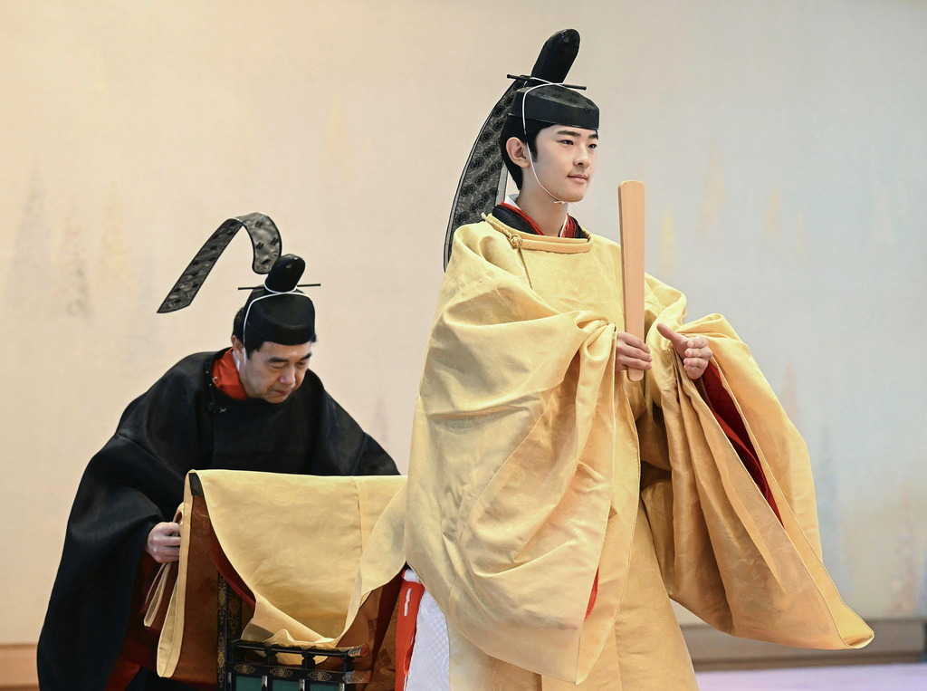FILE - Japan's Prince Hisahito, right, attends his coming-of-age rituals on his 19th birthday at the Imperial Palace in Tokyo, on Sept. 6, 2025. (Japan Pool/Kyodo News via AP, File)