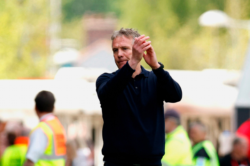 Wrexham manager Phil Parkinson applauds the fans following the EFL Championship soccer match between Wrexham and Middlesbrough, in Wrexham, Wales, Saturday May 2, 2026. (Cody Froggatt/PA via AP)