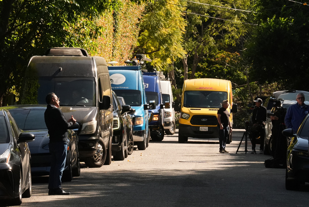 Media stages outside Rihanna's residence Monday, March 9, 2026, in Beverly Hills, Calif. (AP Photo/Damian Dovarganes)