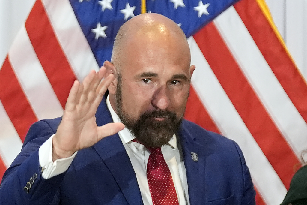 Florida Senator Jay Collins (R-District 14) waves to the crowd after being sworn in as the new Lieutenant Governor of Florida during a news conference Tuesday, Aug. 12, 2025, in Tampa, Fla. (AP Photo/Chris O'Meara)