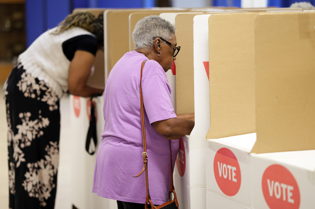 Voters mark ballots at a polling location inside Millwood Field House, Tuesday, June 16, 2026, in Oklahoma City. (AP Photo/Nate Billings)