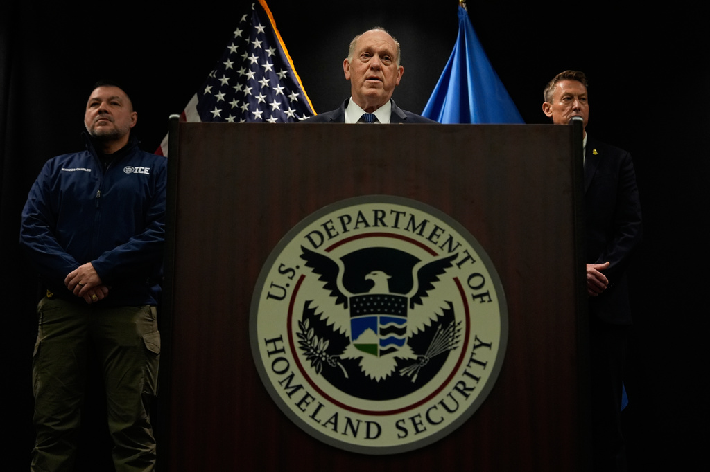 White House border czar Tom Homan holds a news conference as Marcos Charles and Rodney Scott, listen, at the Bishop Whipple Federal building on Thursday, Jan. 29, 2026 in Minneapolis. (AP Photo/Julia Demaree Nikhinson)
