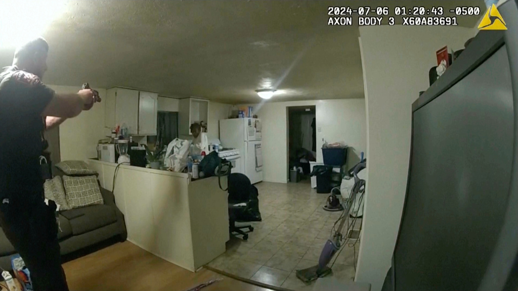 FILE - In this image taken from body camera video released by Illinois State Police on July 22, 2024, former Sangamon County Sheriff's Deputy Sean Grayson, left, points his gun at Sonya Massey, who called 911 for help, before shooting and killing her inside her home in Springfield, Ill., July 6, 2024. (Illinois State Police via AP, File)