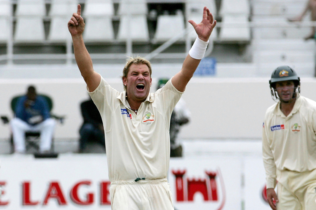 FILE - Australia's bowler Shane Warne, left, reacts on the fifth and final day of the second Test cricket match against South Africa at Kingsmead in Durban, South Africa, Tuesday, March 28, 2006. (AP Photo/Themba Hadebe, File)