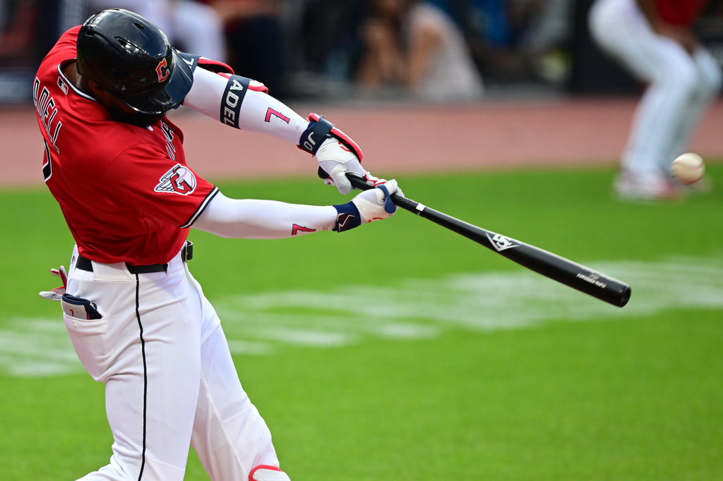 Cleveland Guardians' Jo Adell hits a three-run home run off San Francisco Giants starting pitcher Carson Whisenhunt during the first inning of a baseball game, Tuesday, Aug. 18, 2026, in Cleveland. (AP Photo/David Dermer)