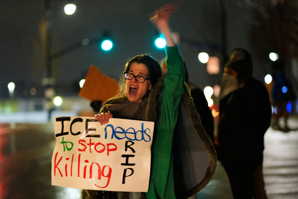 Shellie Rodgers protests during a rally for Renee Good, who was fatally shot by an ICE officer in Minneapolis the day before, Thursday, Jan. 8, 2026, in Kansas City, Mo. (AP Photo/Charlie Riedel)