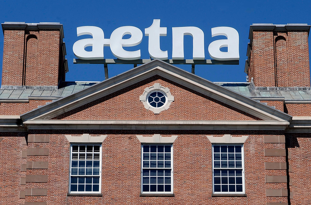 FILE - The corporate sign atop Aetna headquarters is seen Aug. 19, 2014, in Hartford, Conn. (AP Photo/Jessica Hill, File)
