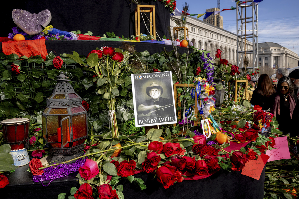 Attendees gather during a public memorial for Grateful Dead co-founder Bob Weir at Civic Center Plaza in San Francisco, Saturday, Jan. 17, 2026. (Stephen Lam/San Francisco Chronicle via AP)