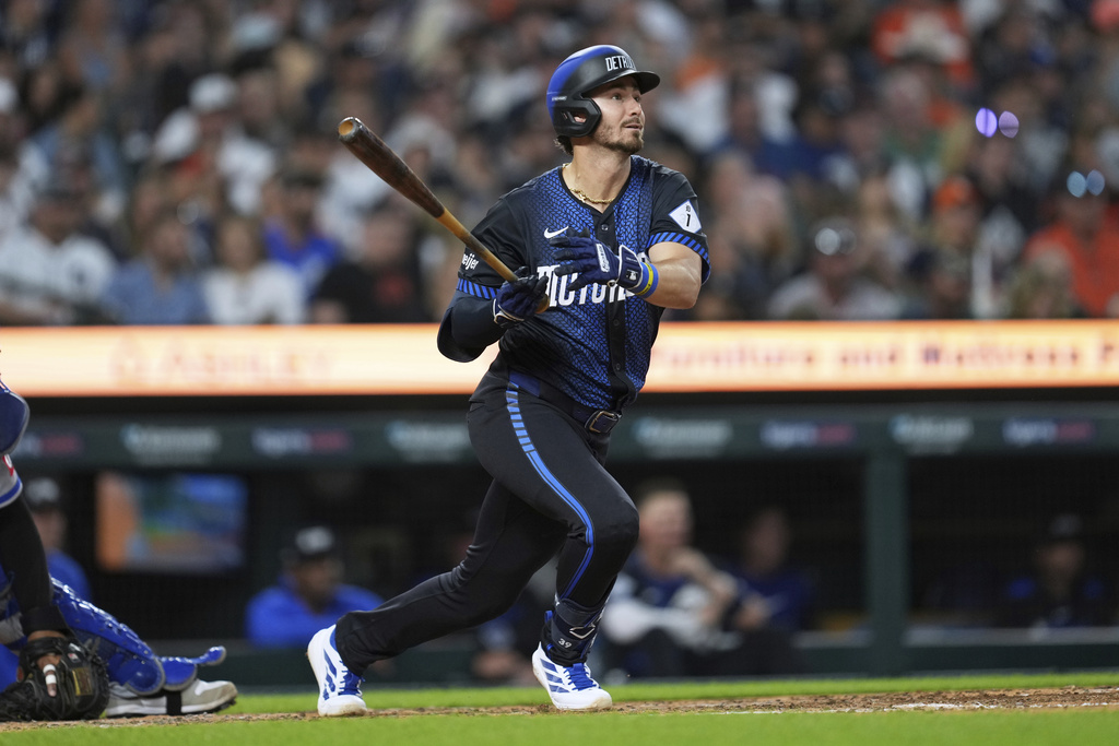 Detroit Tigers' Zach McKinstry hits a triple against the Kansas City Royals in the fifth inning during a baseball game Friday, Aug. 22, 2025, in Detroit. (AP Photo/Paul Sancya)