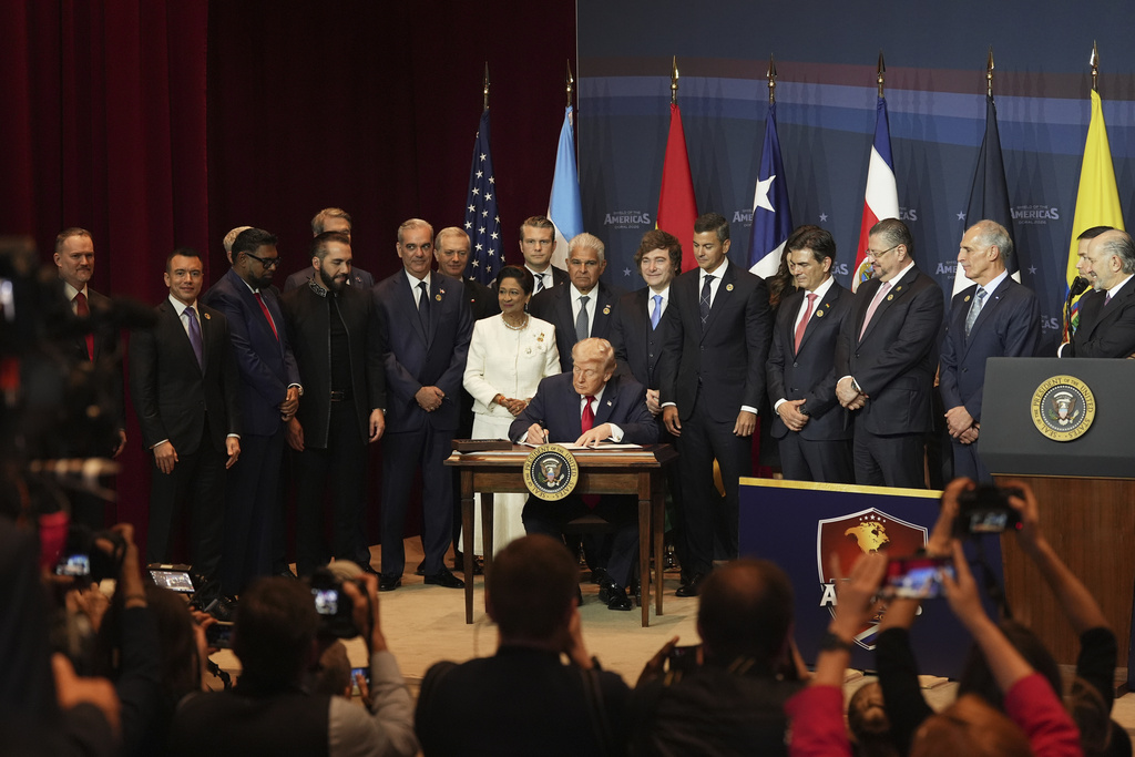 President Donald Trump signs a proclamation committing to countering cartel criminal activity at the Shield of the Americas Summit, Saturday, March 7, 2026, at Trump National Doral Miami in Doral, Fla. (AP Photo/Rebecca Blackwell)