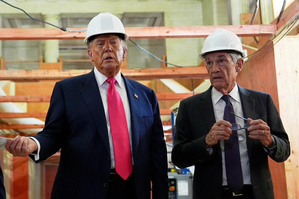 FILE - President Donald Trump speaks with Federal Reserve Chairman Jerome Powell during a visit to the Federal Reserve, Thursday, July 24, 2025, in Washington. (AP Photo/Julia Demaree Nikhinson, File)