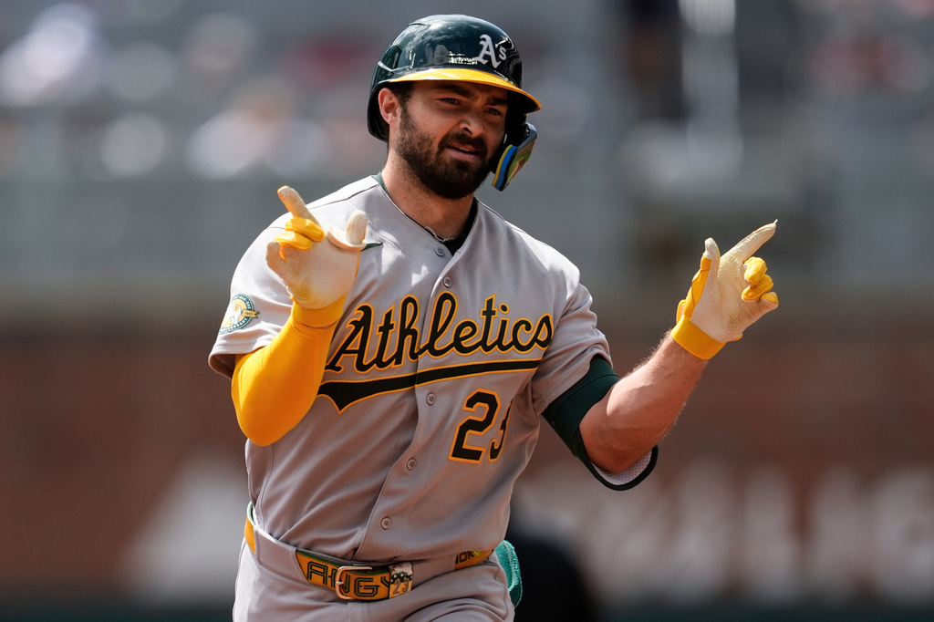 Athletics' Shea Langeliers (23) celebrates his solo home run in the fourth inning of a baseball game against the Atlanta Braves, Wednesday, April 1, 2026, in Atlanta. (AP Photo/Mike Stewart)