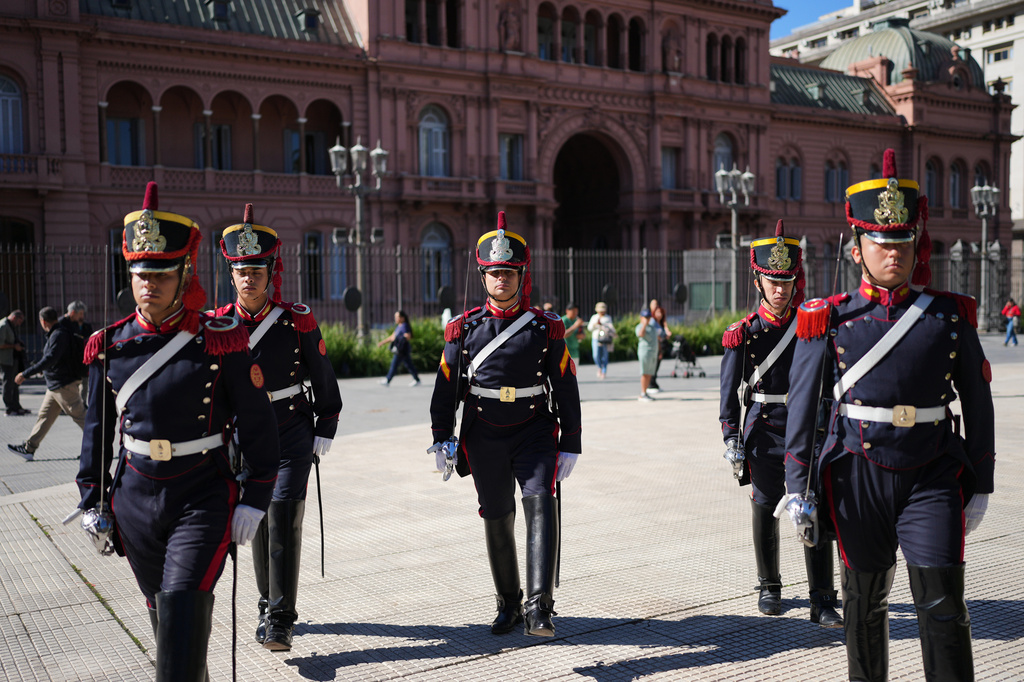 Honor guards march outside government house in Buenos Aires, Argentina, Thursday, April 23, 2026. (AP Photo/Rodrigo Abd)